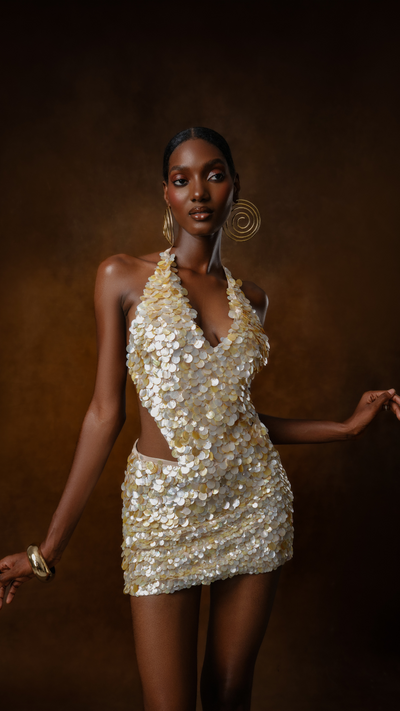 Aje Shell Halter Top, plunge neckline with shell embellishment, front view.